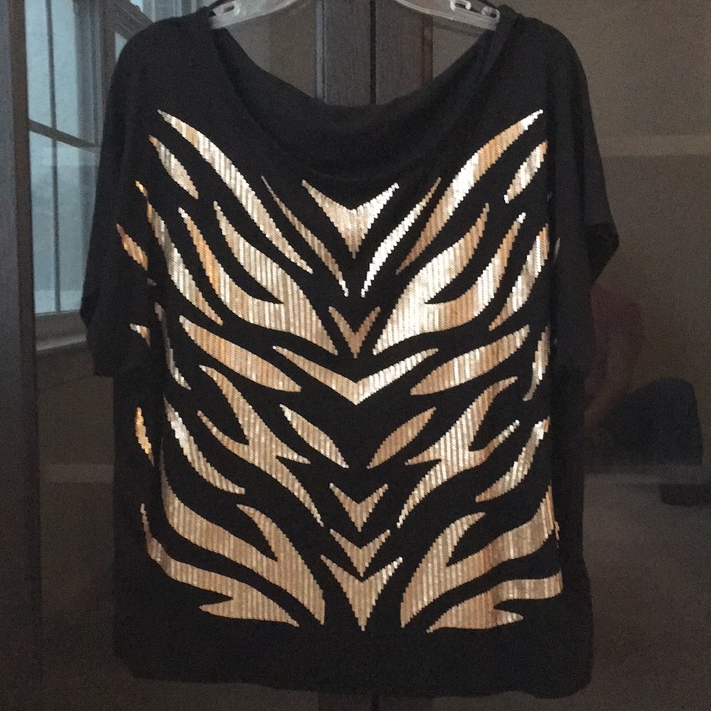 Black with gold sequins loose fitting top.